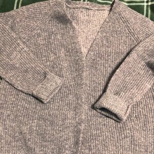 Grey cardigan with no tie or buttons. Men’s medium, runs small